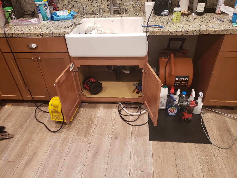water damage under kitchen sink