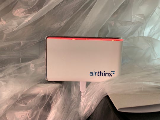 Airthinx IAQ professional-grade air quality monitor shows a red light signaling poor quality during recent renovations of the author's house in West Oakland, Calif.